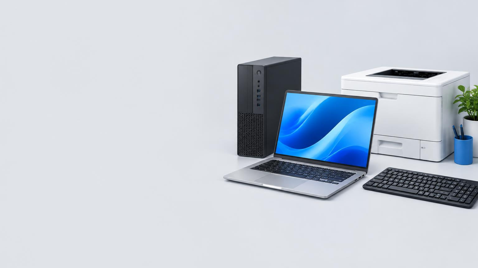 Laptop, desktop and printer arranged in a technology studio